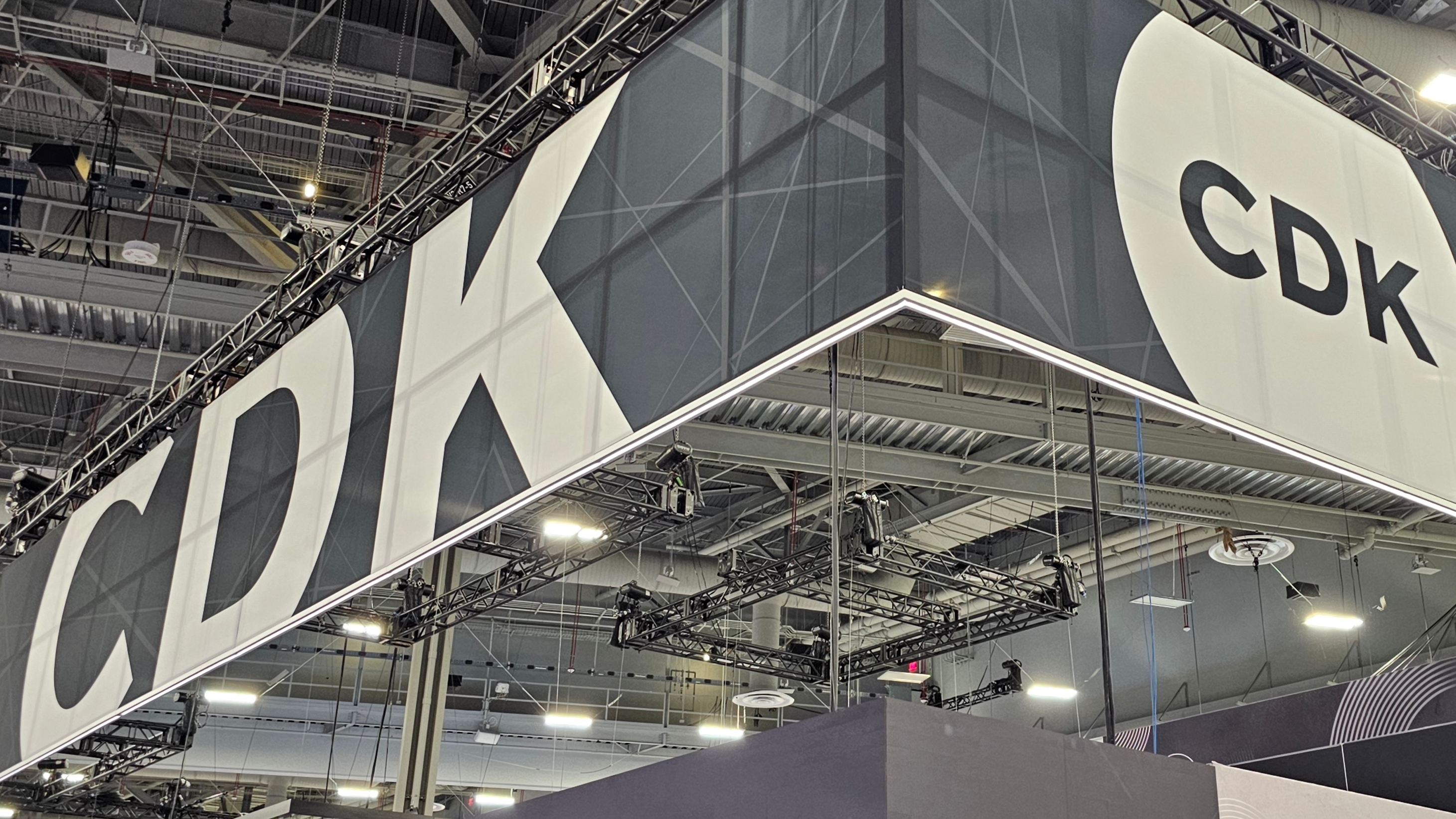 CDK Global’s declining debt value raises concerns about future dealership tech investments