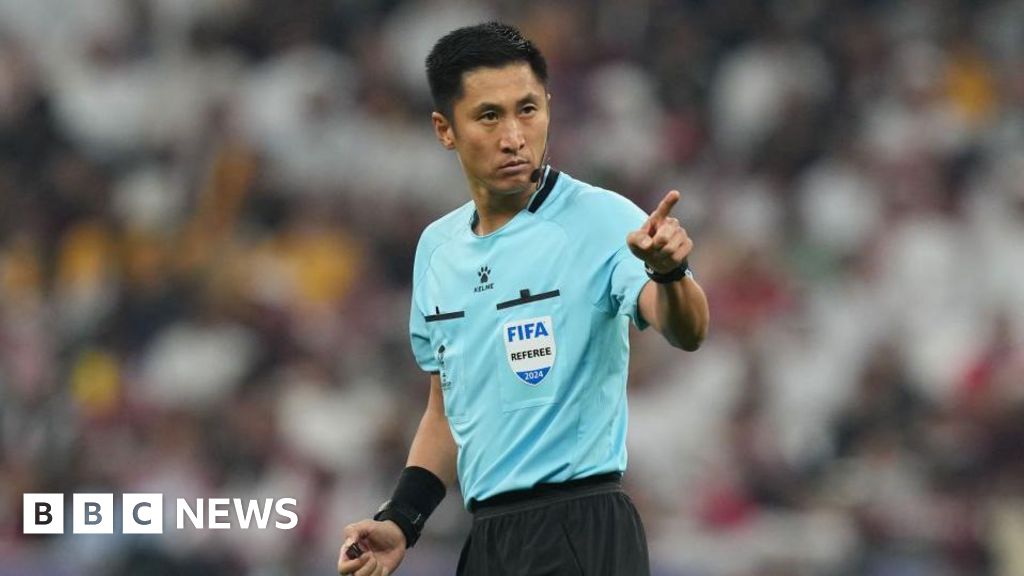 With no team on the field, China fans pin hopes on World Cup referee