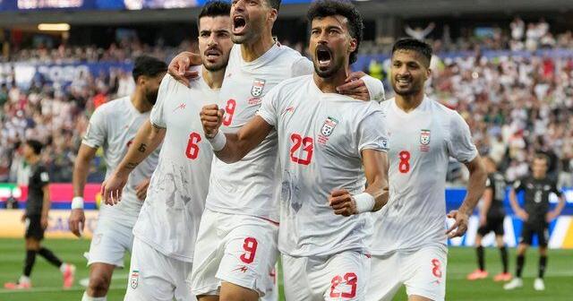 Iran opens politically charged World Cup by playing to 2