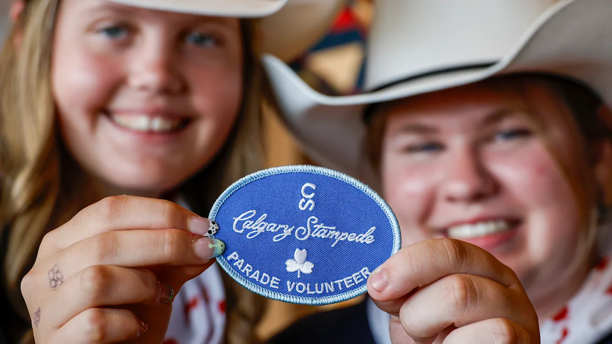 Stampede parade giving badges to girl guides