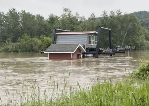 Floodwaters inundate base area at Asessippi