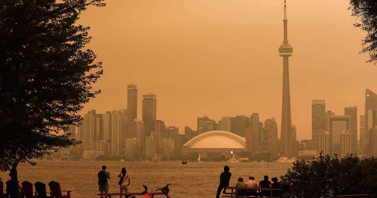 Wildfire smoke blankets Toronto, turning skies orange and prompting air quality warning
