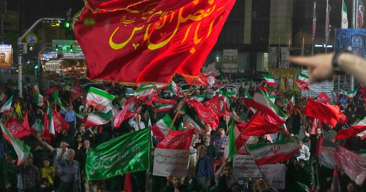 Iran says it is suspending commitments to interim deal with US as they exchange attacks