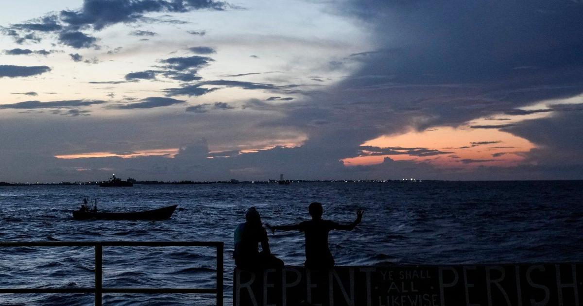 A ferry carrying 133 people capsizes off Guyana's coast, leaving dozens missing
