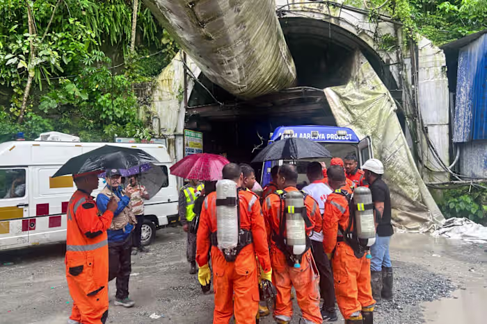 Toxic gas slows efforts to rescue 13 workers trapped in India hydropower tunnel