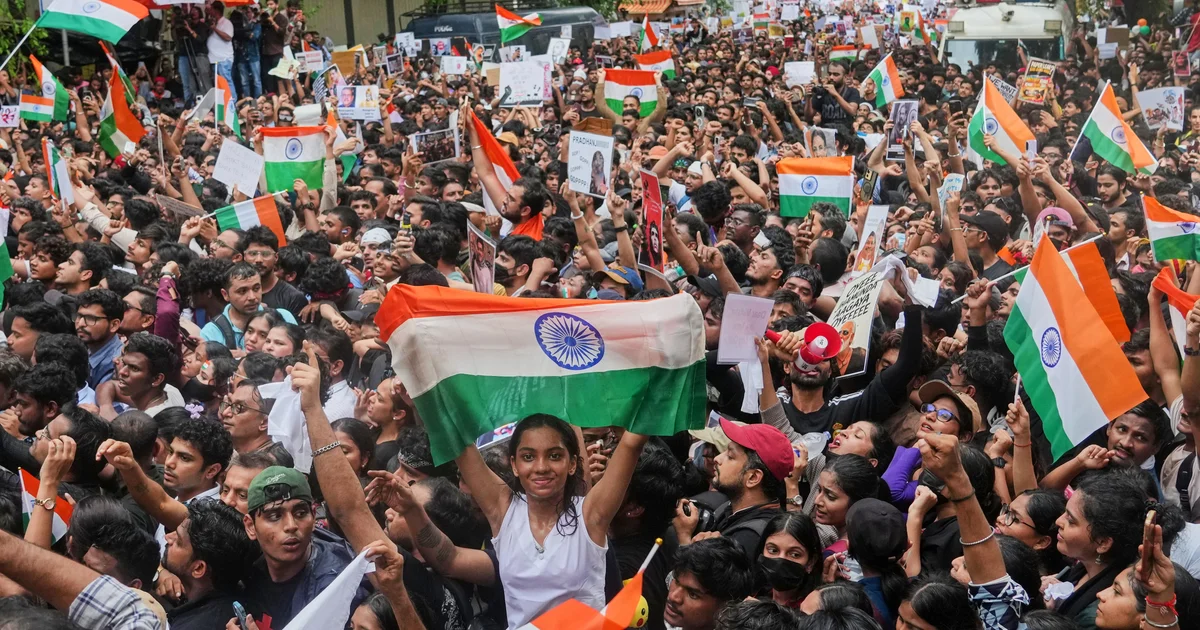 India's education minister steps down after weeks of protests led by "Cockroach" party