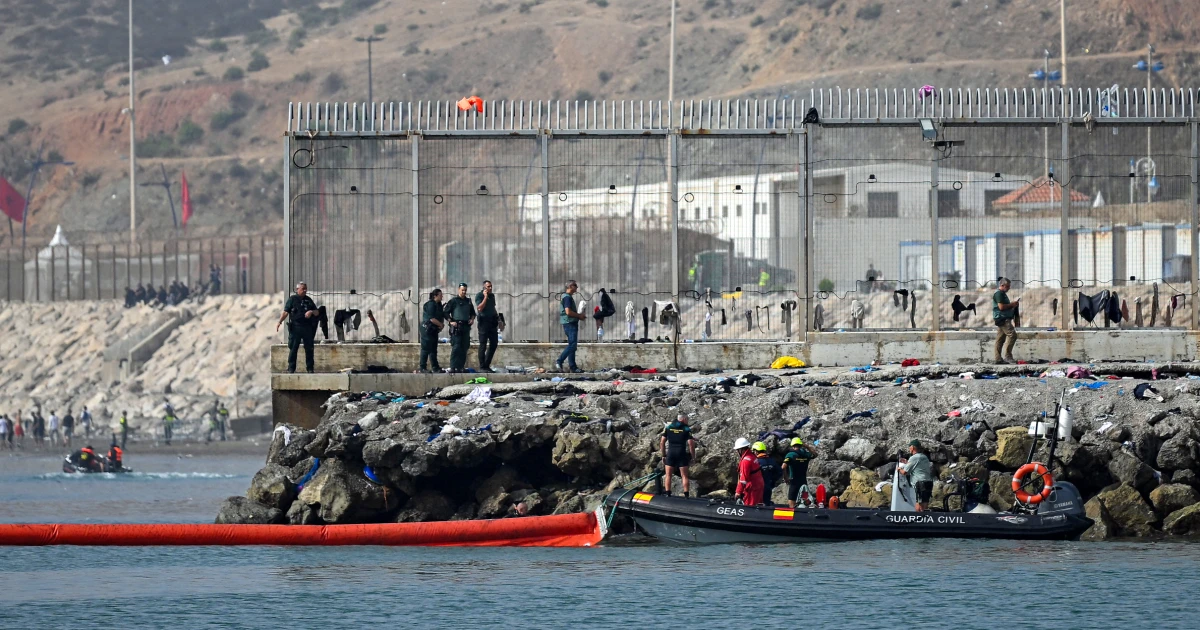 Spain to put containment fence on Ceuta’s sea border with Morocco after thousands rush through