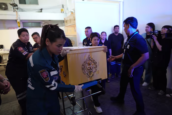 Families retrieve bodies after a 14-year