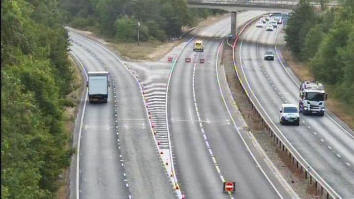 Overturned lorry partially blocks busy A