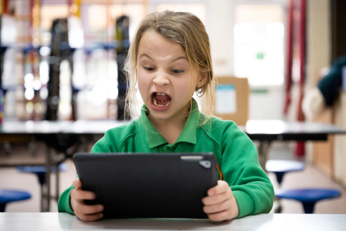 Alpha School wants AI to teach a billion kids. Should it?