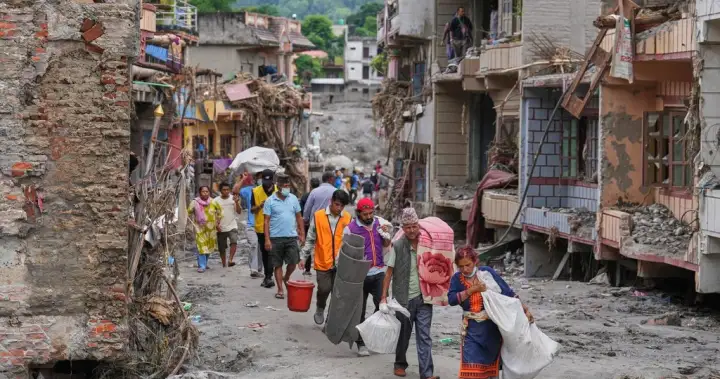 Nepal flood survivors reach safe areas as families await news of missing
