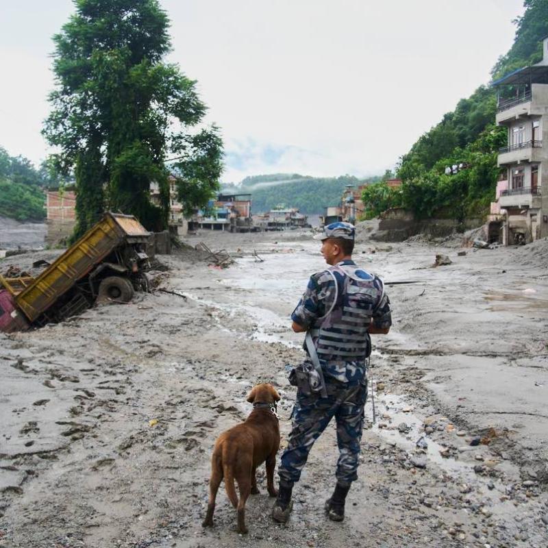 Rescuers retrieve Nepal flood survivors caked in mud