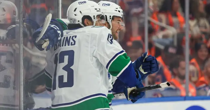Cotter, Canucks outlast Oilers 6
