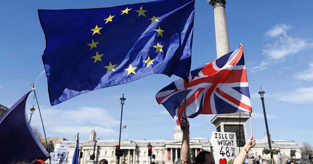 ‘Welcome back,’ says Macron, as U.K. PM opens door to EU return
