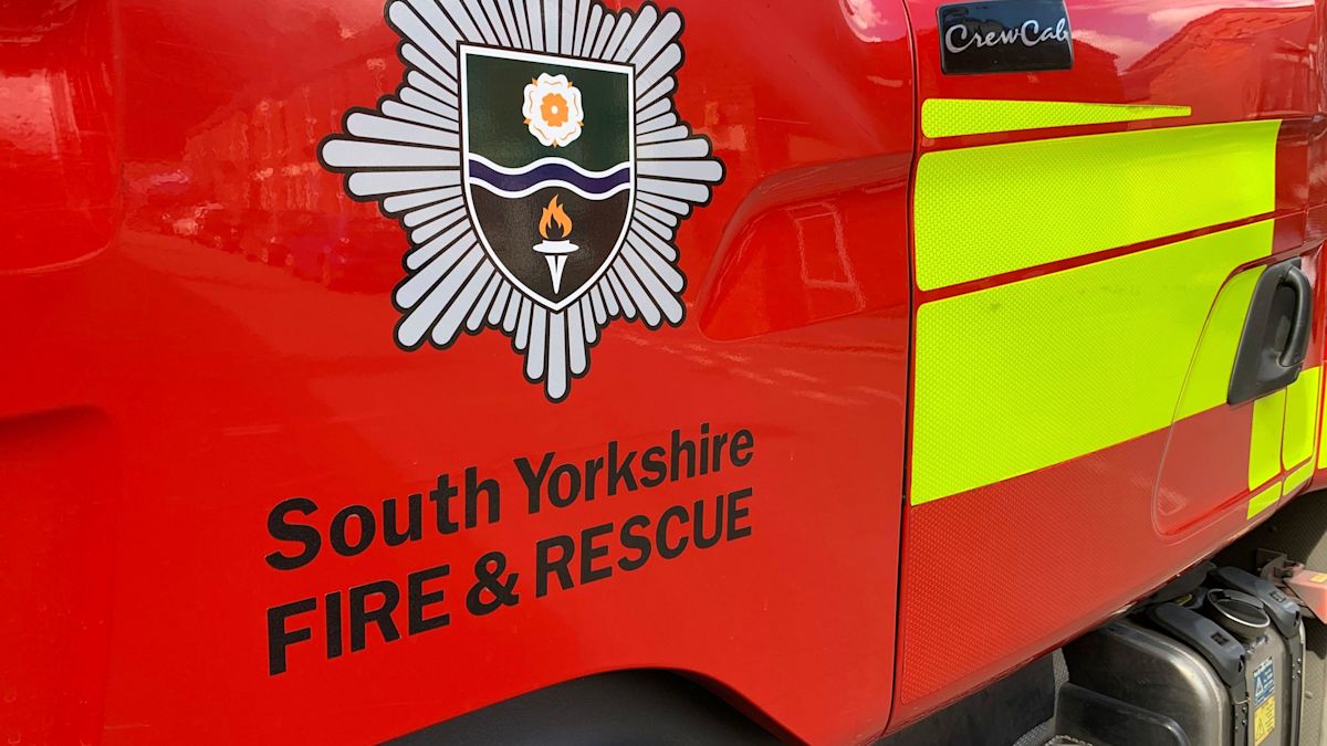 House fire causes disruption to school and road