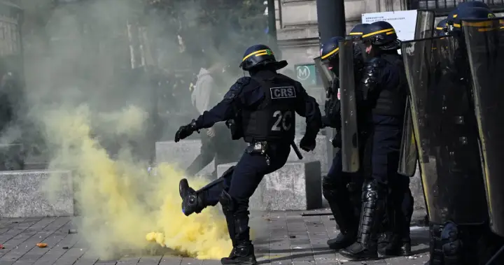 Scuffles break out as protesters rally across France, joining students